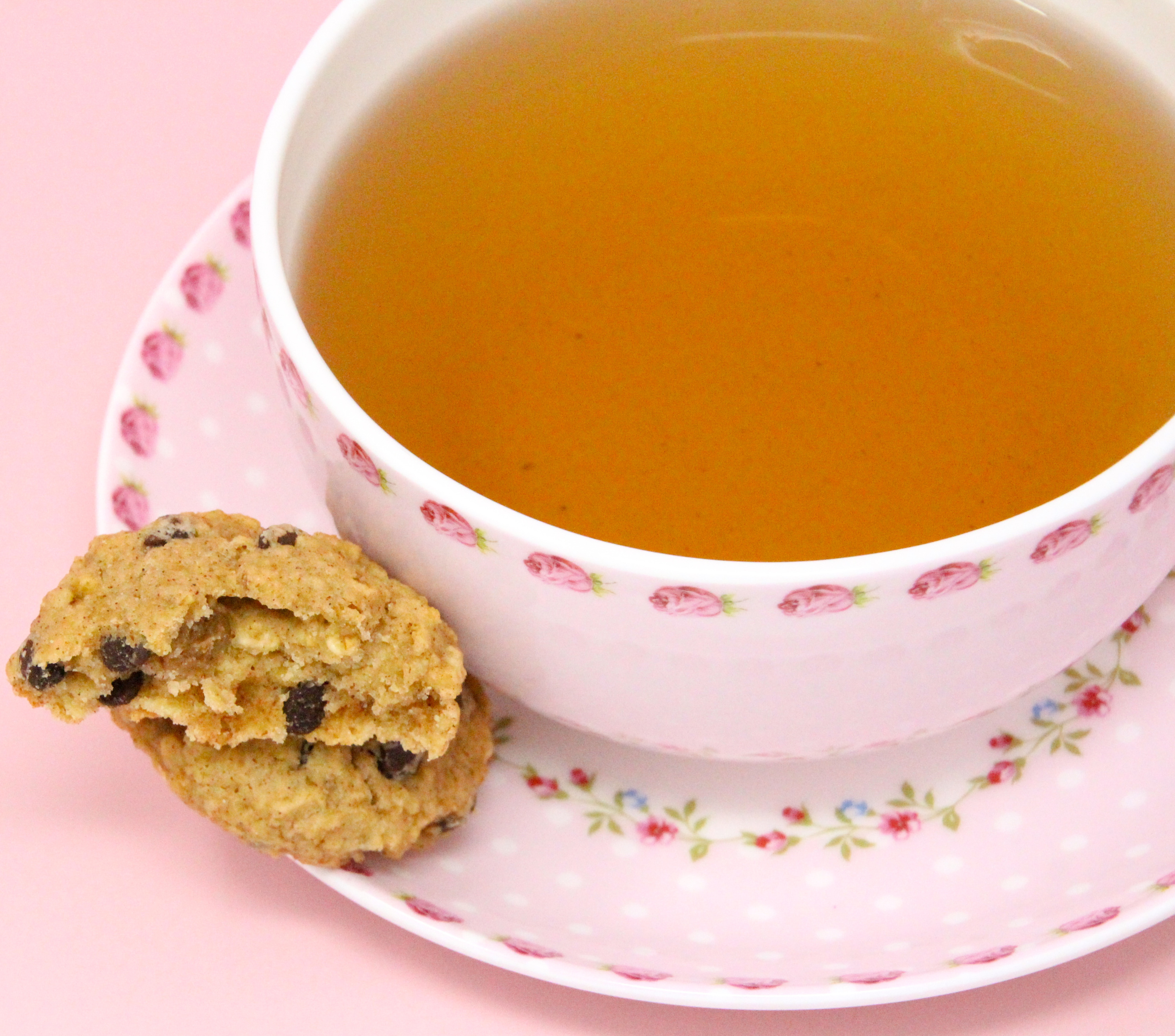 Oatmeal Honey Chocolate Chip Cookies are a healthy twist to the original. The addition of honey, applesauce, golden raisins, and chocolate chips makes these sweet enough and perfect for a delicious after-school snack or tea time pick-me-up. Recipe shared with permission granted by Daryl Wood Gerber, author of ESSENCE OF FOUL PLAY. 