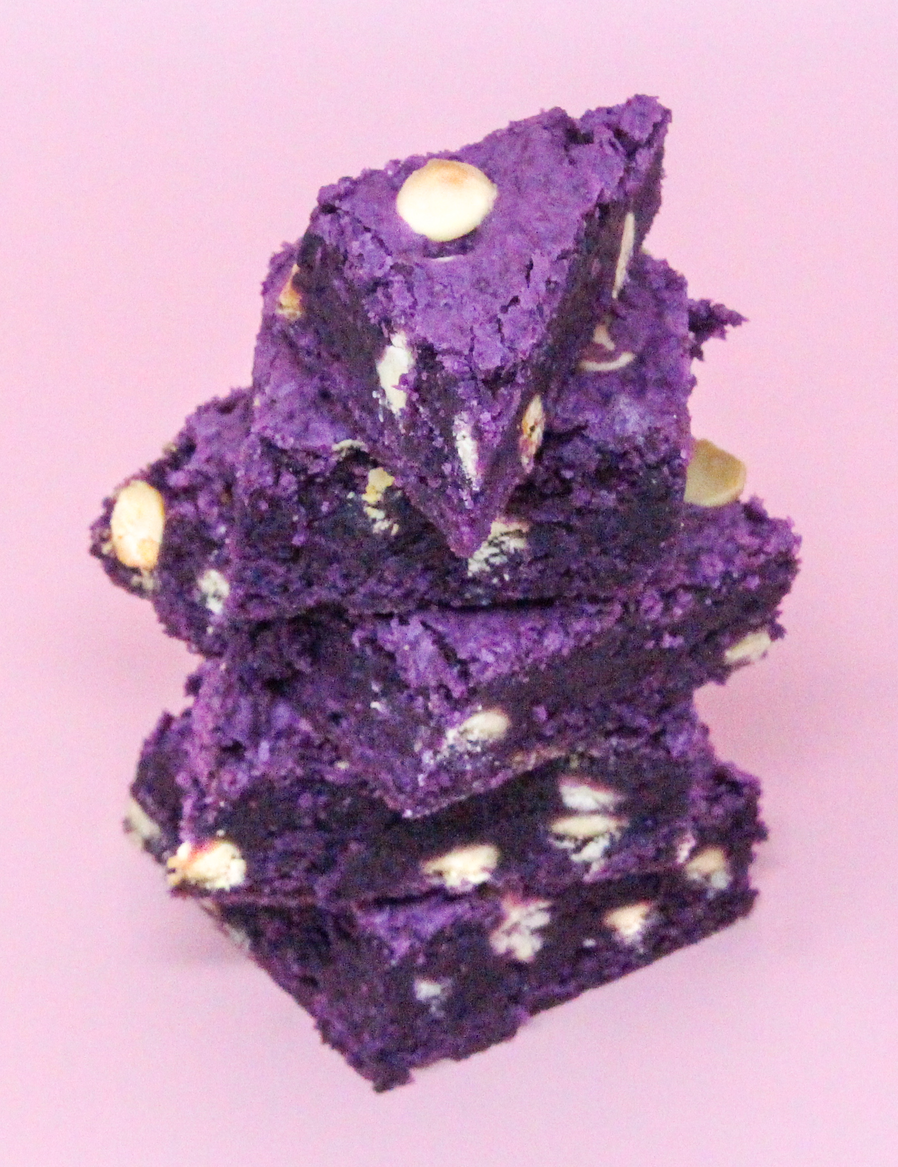 Ube Blondies uses ube jam (from a purple yam) for added sweetness and adds a fun purple color to the blondies. These have a perfect chewy texture with white chocolate chips providing a creamy contrast. Recipe shared with permission granted by Leslie Karst, author of WATERS OF DESTRUCTION.