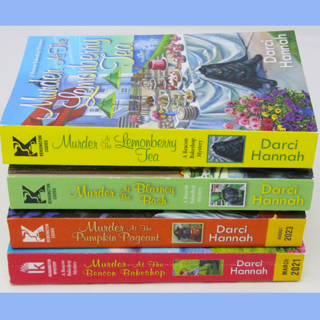 Win 4 books in the Beacon Bakeshop Mystery series by Darci Hannah! Books included are Murder at the Beacon Bakeshop; Murder at the Pumpkin Pageant; Murder at the Blarney Bash; Murder a the Lemonberry Tea.