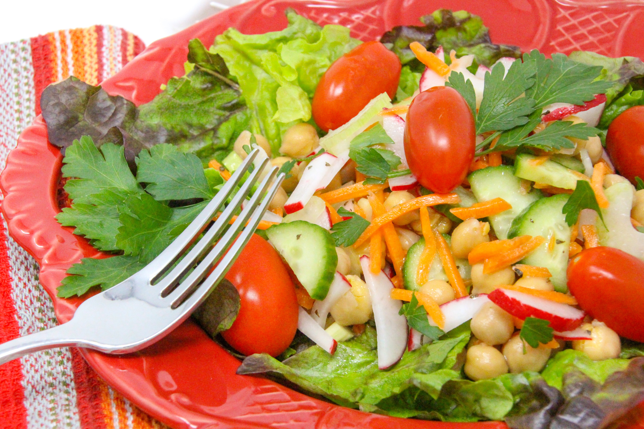 Super Simple Salad Jars are quick to mix up ahead of time and convenient to have on hand for a nourishing lunch or light supper. Mix and match your favorite salad topper ingredients then add to lettuce right before serving. Recipe shared with permission granted by Victoria Hamilton, author of CAT GOT YOUR TONGS. 