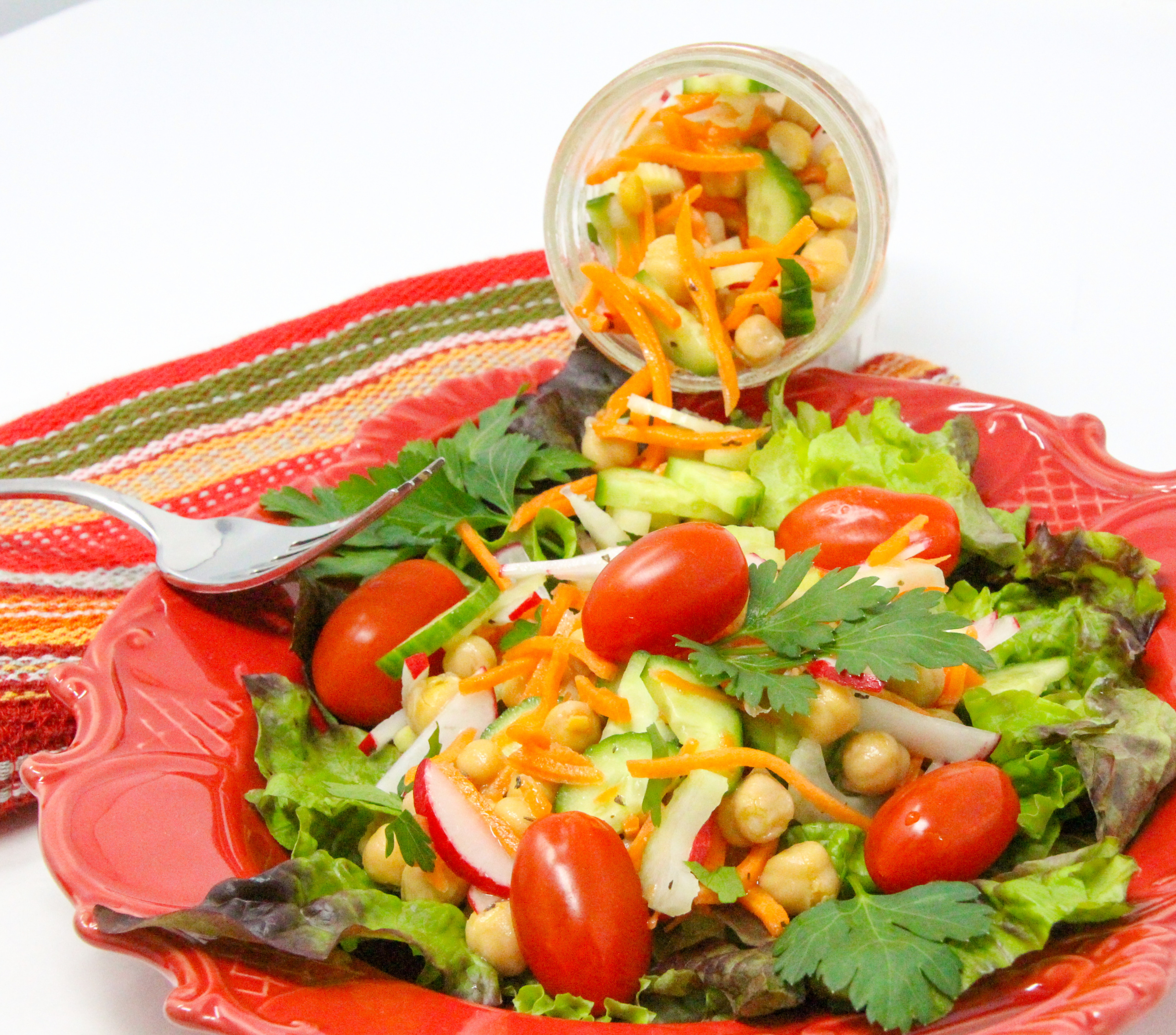 Super Simple Salad Jars are quick to mix up ahead of time and convenient to have on hand for a nourishing lunch or light supper. Mix and match your favorite salad topper ingredients then add to lettuce right before serving. Recipe shared with permission granted by Victoria Hamilton, author of CAT GOT YOUR TONGS. 