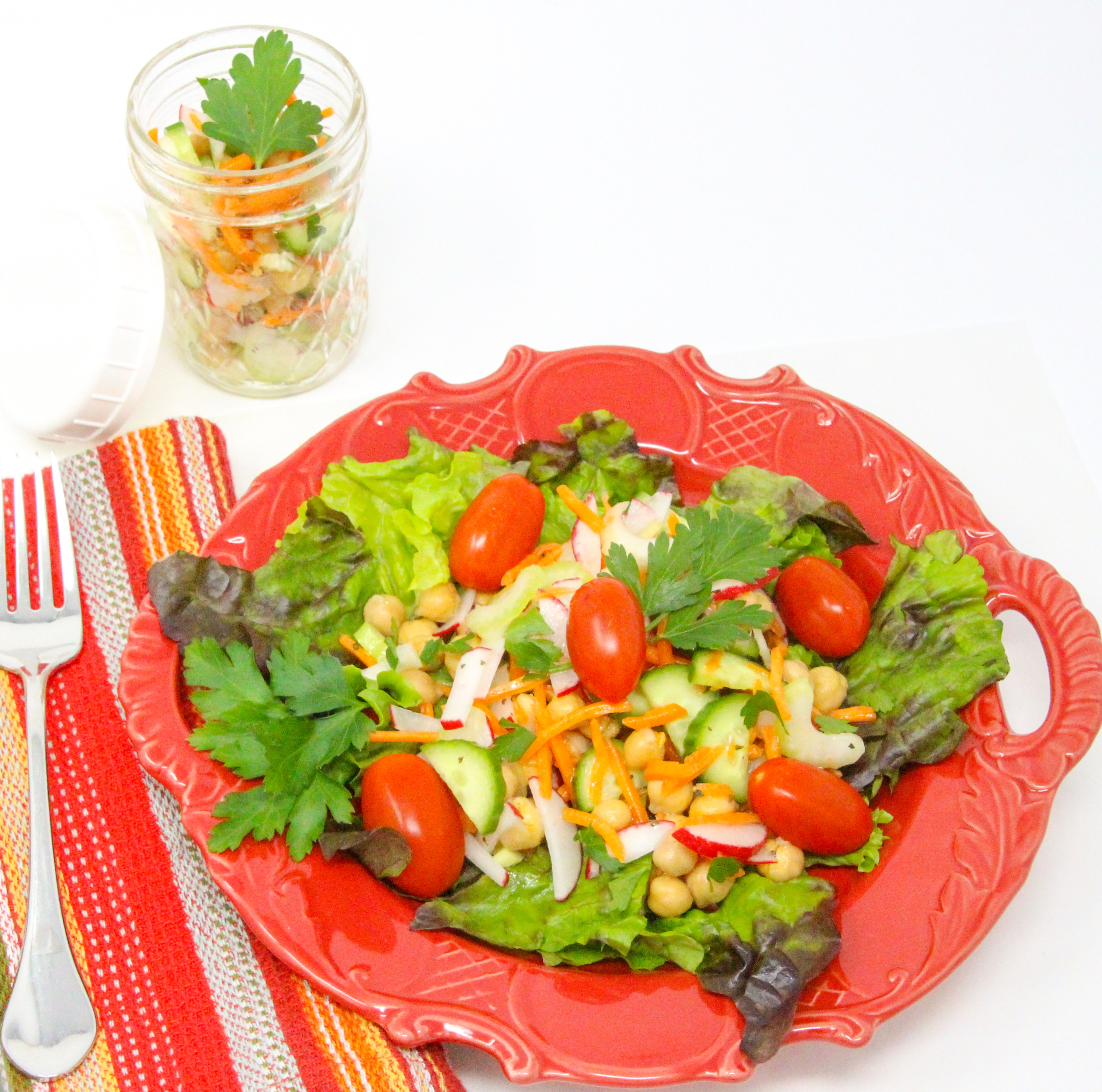 Super Simple Salad Jars are quick to mix up ahead of time and convenient to have on hand for a nourishing lunch or light supper. Mix and match your favorite salad topper ingredients then add to lettuce right before serving. Recipe shared with permission granted by Victoria Hamilton, author of CAT GOT YOUR TONGS. 
