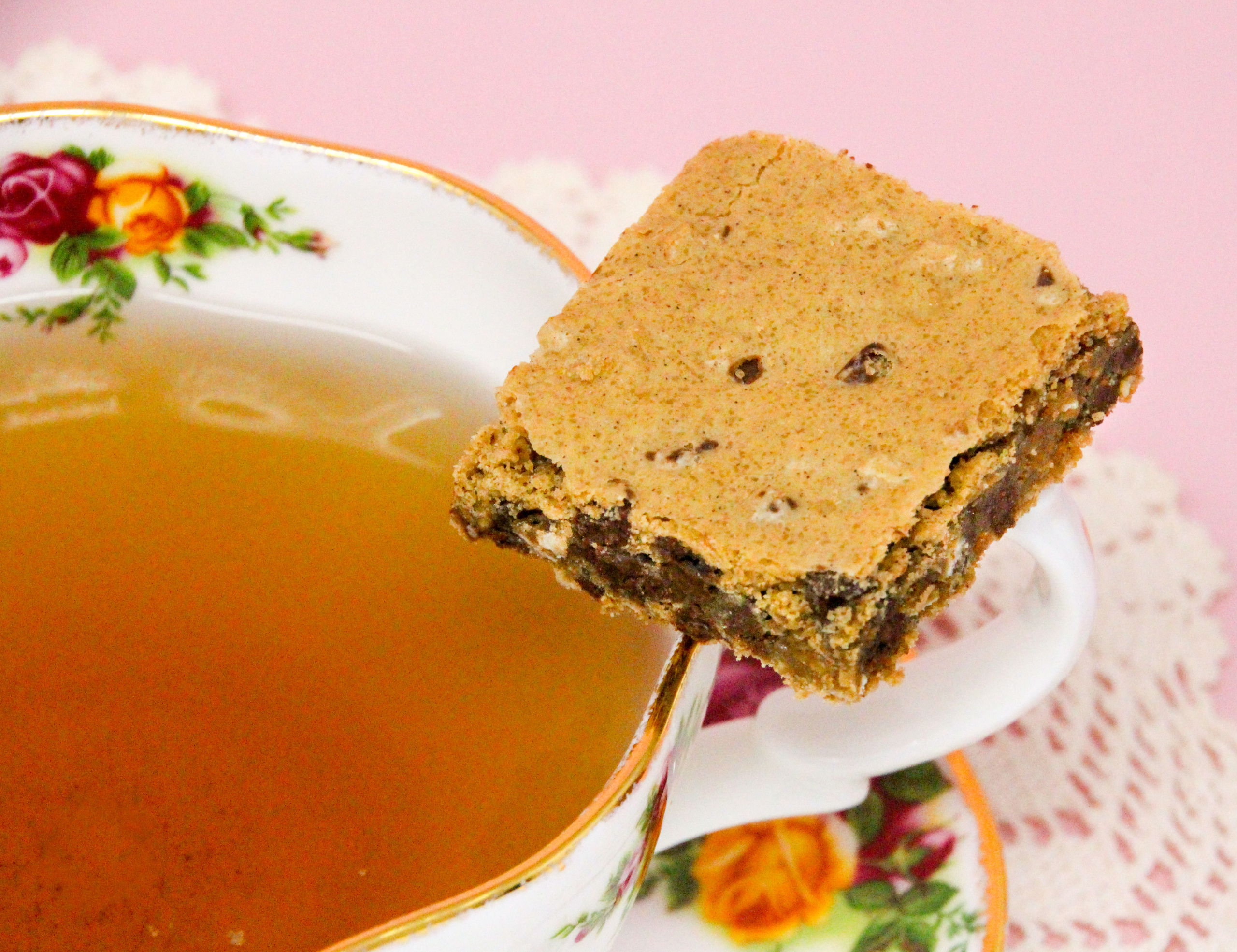 Oatmeal Chocolate Chip Bars are rich, chewy, and oh-so-yummy! The oatmeal provides a nice texture to the bars, and there is a decadent amount of chocolate chips to keep the bars gooey. Recipe shared with permission granted by Emmeline Duncan, author of FATAL BROUHAHA. 