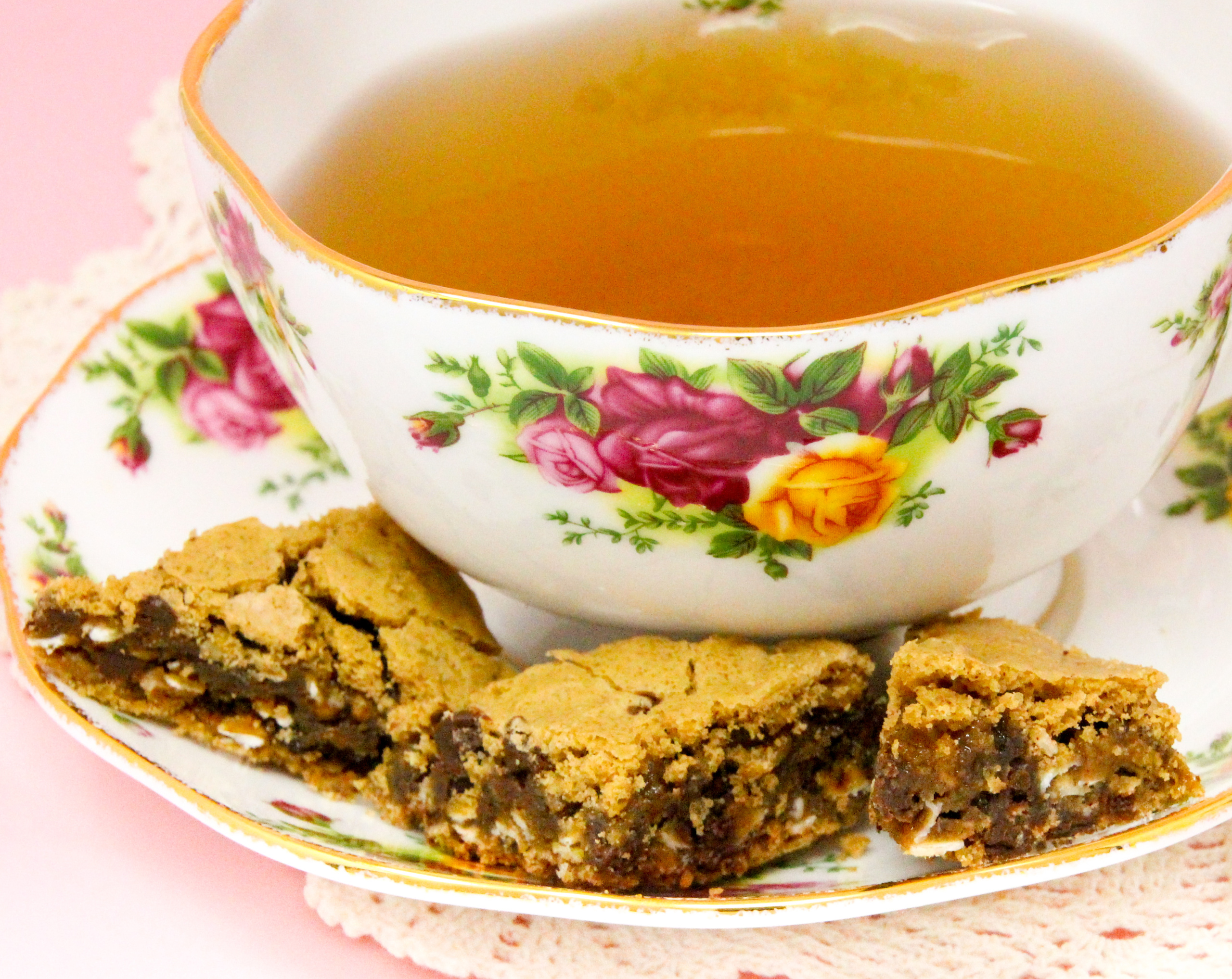 Oatmeal Chocolate Chip Bars are rich, chewy, and oh-so-yummy! The oatmeal provides a nice texture to the bars, and there is a decadent amount of chocolate chips to keep the bars gooey. Recipe shared with permission granted by Emmeline Duncan, author of FATAL BROUHAHA. 