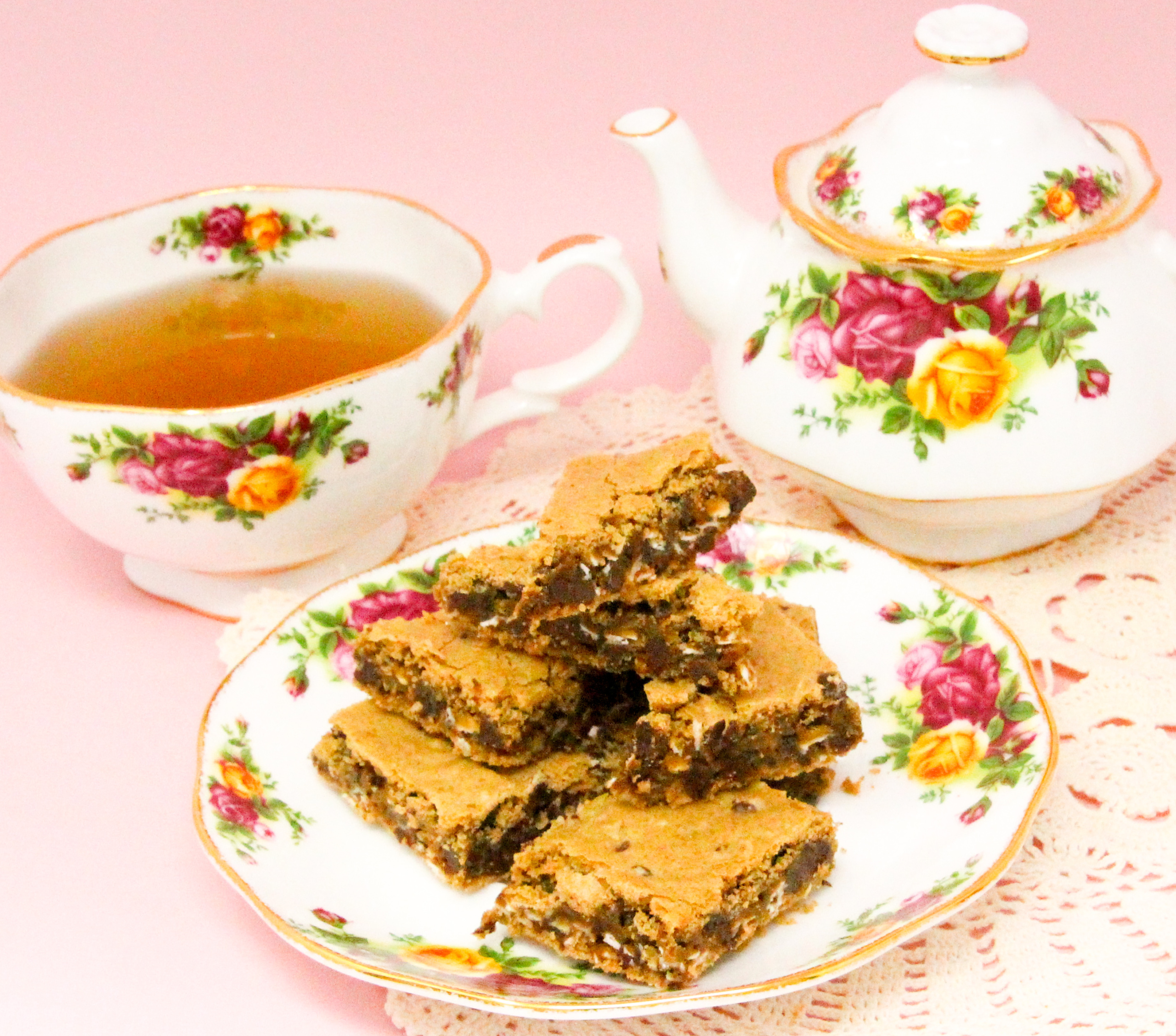 Oatmeal Chocolate Chip Bars are rich, chewy, and oh-so-yummy! The oatmeal provides a nice texture to the bars, and there is a decadent amount of chocolate chips to keep the bars gooey. Recipe shared with permission granted by Emmeline Duncan, author of FATAL BROUHAHA. 