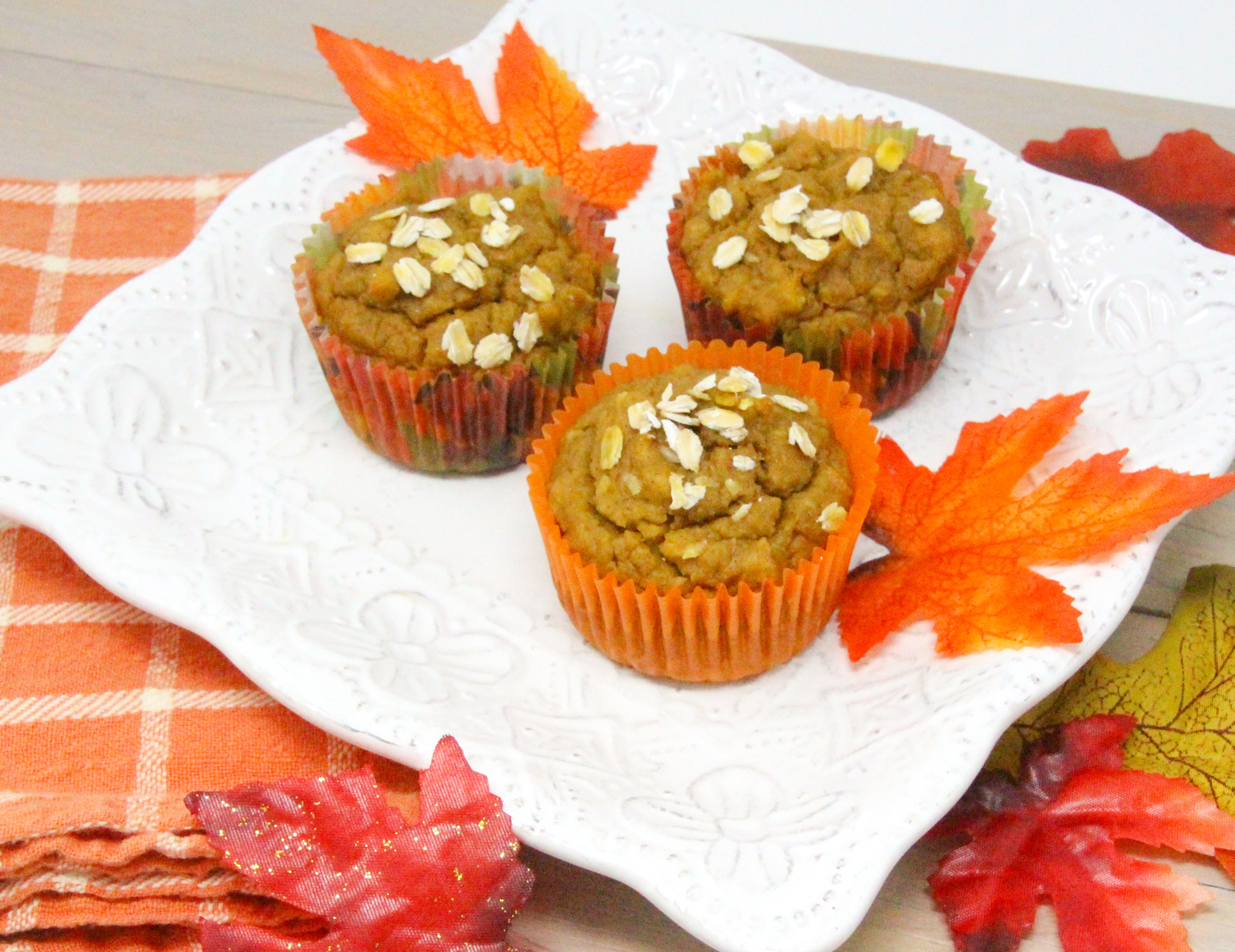 Halloween Muffins are pumpkin-based and not too sweet since they use maple syrup instead of sugar. With a good amount of pumpkin spice to ramp up the flavor, and whole wheat flour and oats, this a healthy and delicious breakfast or snack choice! Recipe shared with permission granted by Maddie Day, author of MURDER AT CAPE COSTUMERS. 