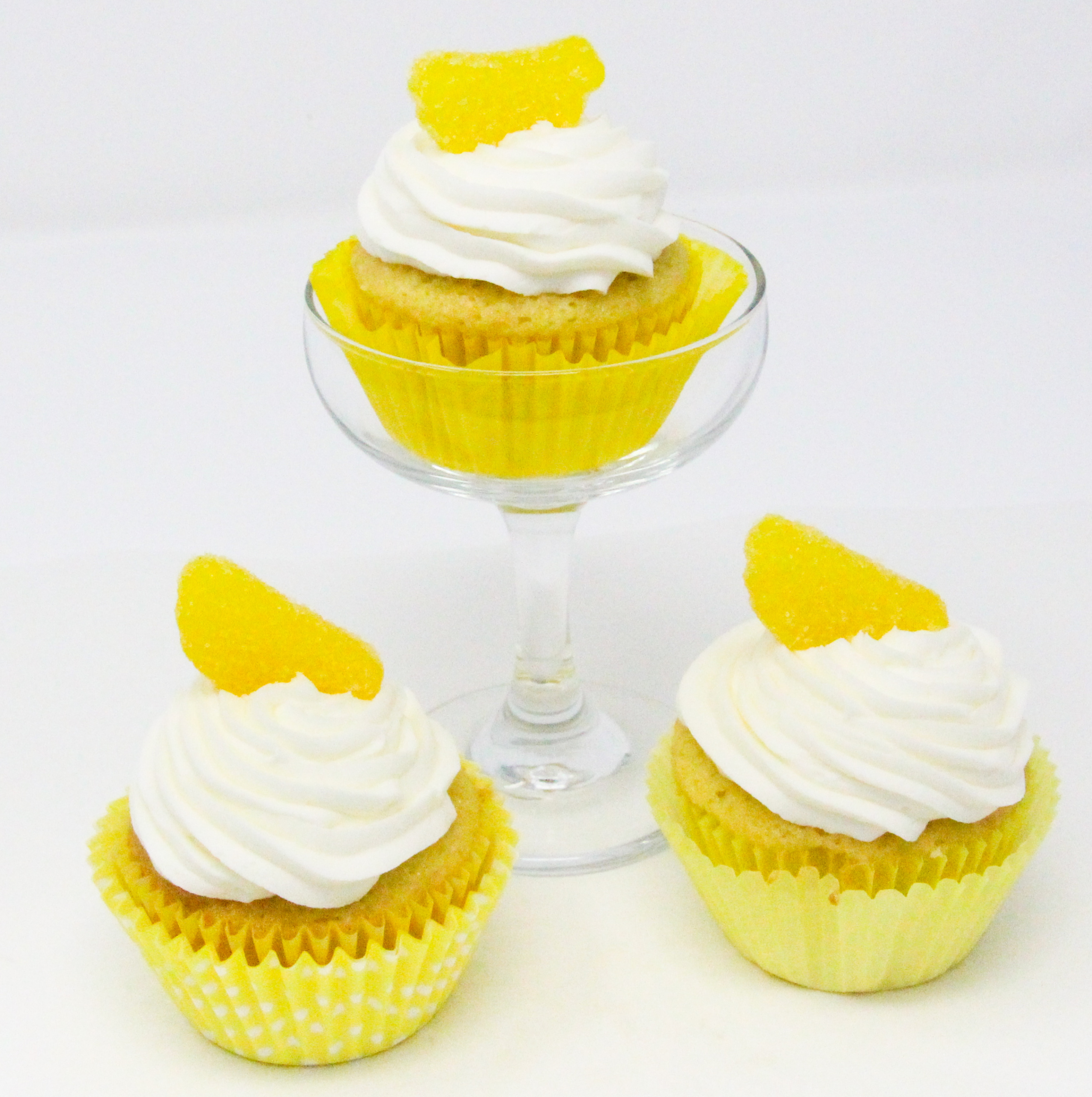 Lemon Drop Martini Cupcakes have a refreshing citrus tang with a bit of a kick, while a surprise filling adds an extra layer of flavor. These are a delicious and tempting dessert for summer gatherings -- for adults only, of course. Recipe from FRAMED AND FROSTED by Kim Davis. 