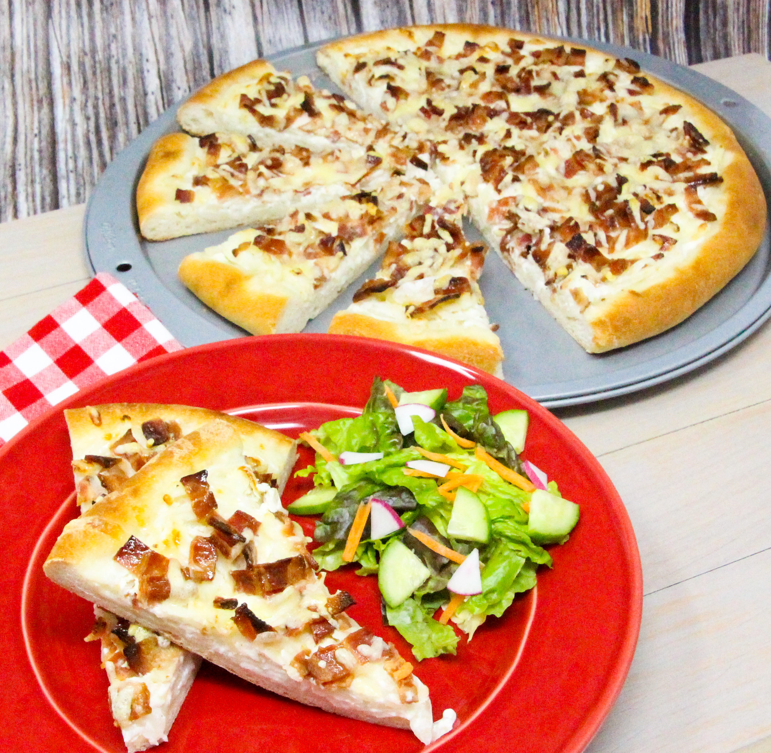 Tarte Flambée is a traditional dish is from Alsace, and is similar to a thin-crust pizza topped with crème fraîche, onions, and lardons or bacon. Rich and oh so yummy, this is a decadent dish served either as a main course or as an appetizer. Recipe shared with permission granted by Ann Claire, author of A CYCLIST'S GUIDE TO VILLIANS & VINES.