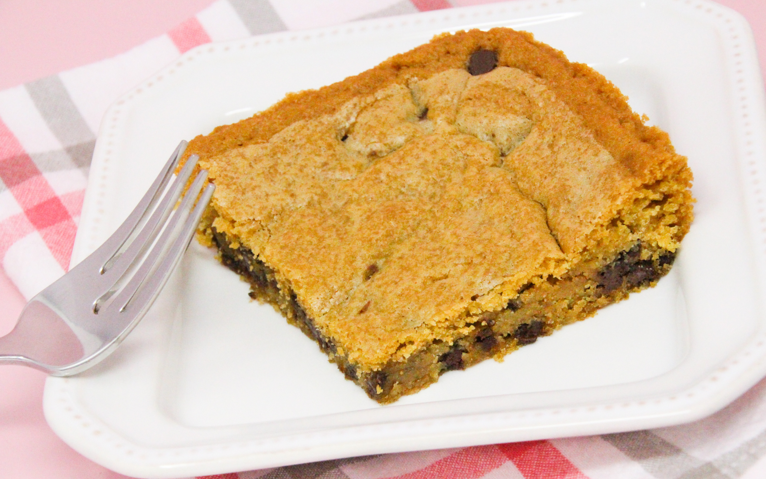 Dixie Spicer's Blonde Brownies are soft and decadent with butter and brown sugar and scattered chocolate chips. It’s like the best part of a chocolate chip cookie. Recipe shared with permission granted by Mary Lee Ashford, author of NIGHT OF THE LIVING BREAD.