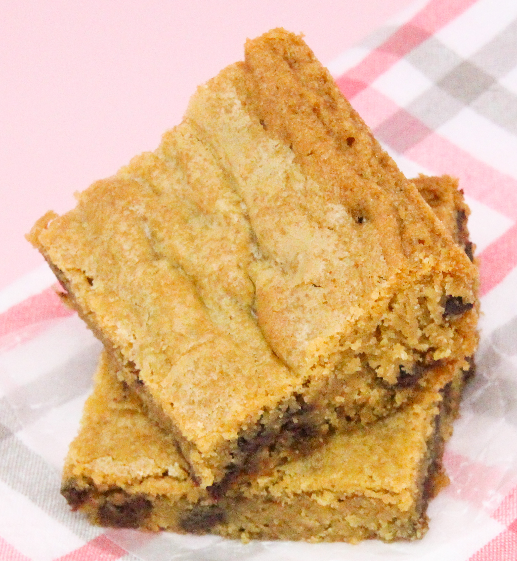 Dixie Spicer's Blonde Brownies are soft and decadent with butter and brown sugar and scattered chocolate chips. It’s like the best part of a chocolate chip cookie. Recipe shared with permission granted by Mary Lee Ashford, author of NIGHT OF THE LIVING BREAD.