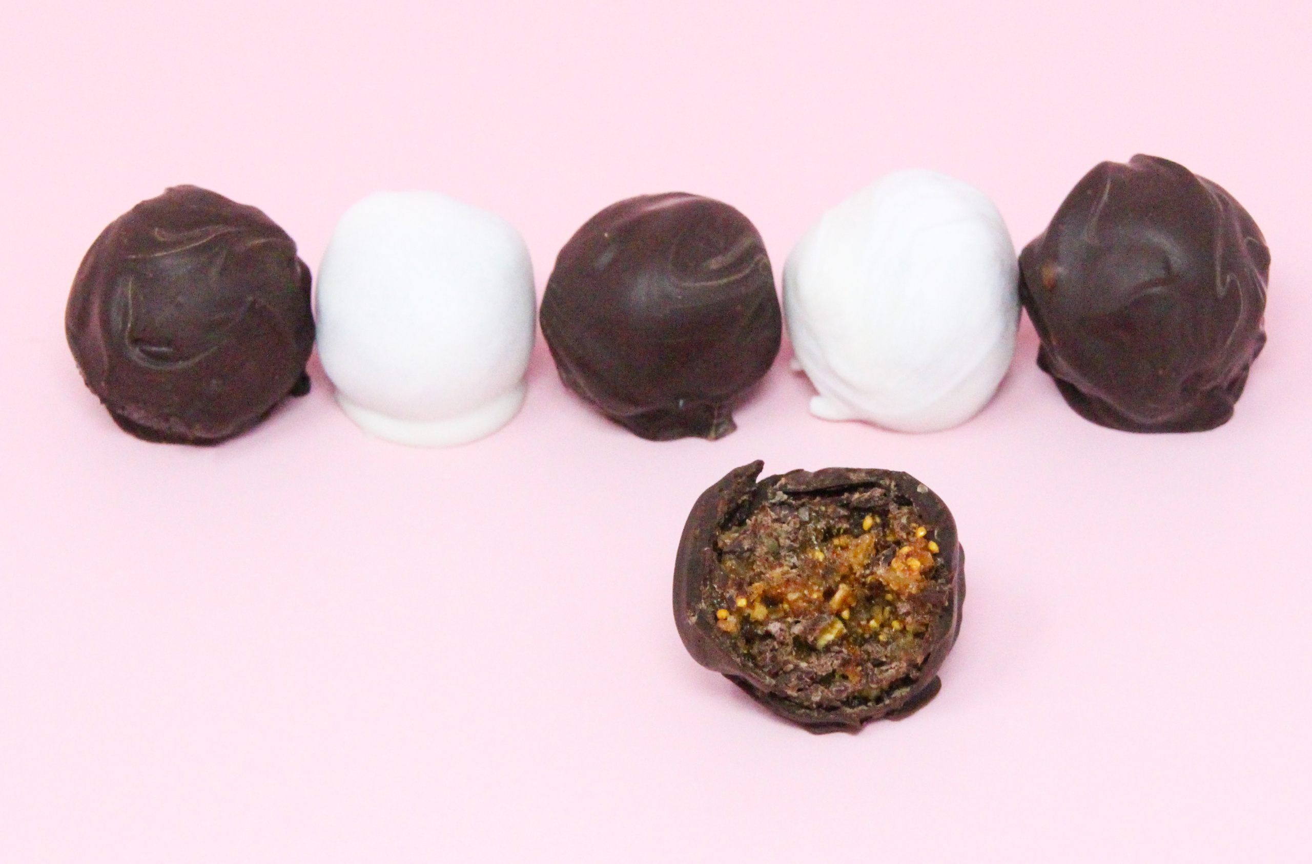 Fig, Ginger, Cardamom Truffles are a tempting combination of figs with spices, all enrobed in dark chocolate, making these scrumptious morsels a perfect bite to end dinner with. Recipe shared with permission granted by Molly MacRae, author of THERE'LL BE SHELL TO PAY.