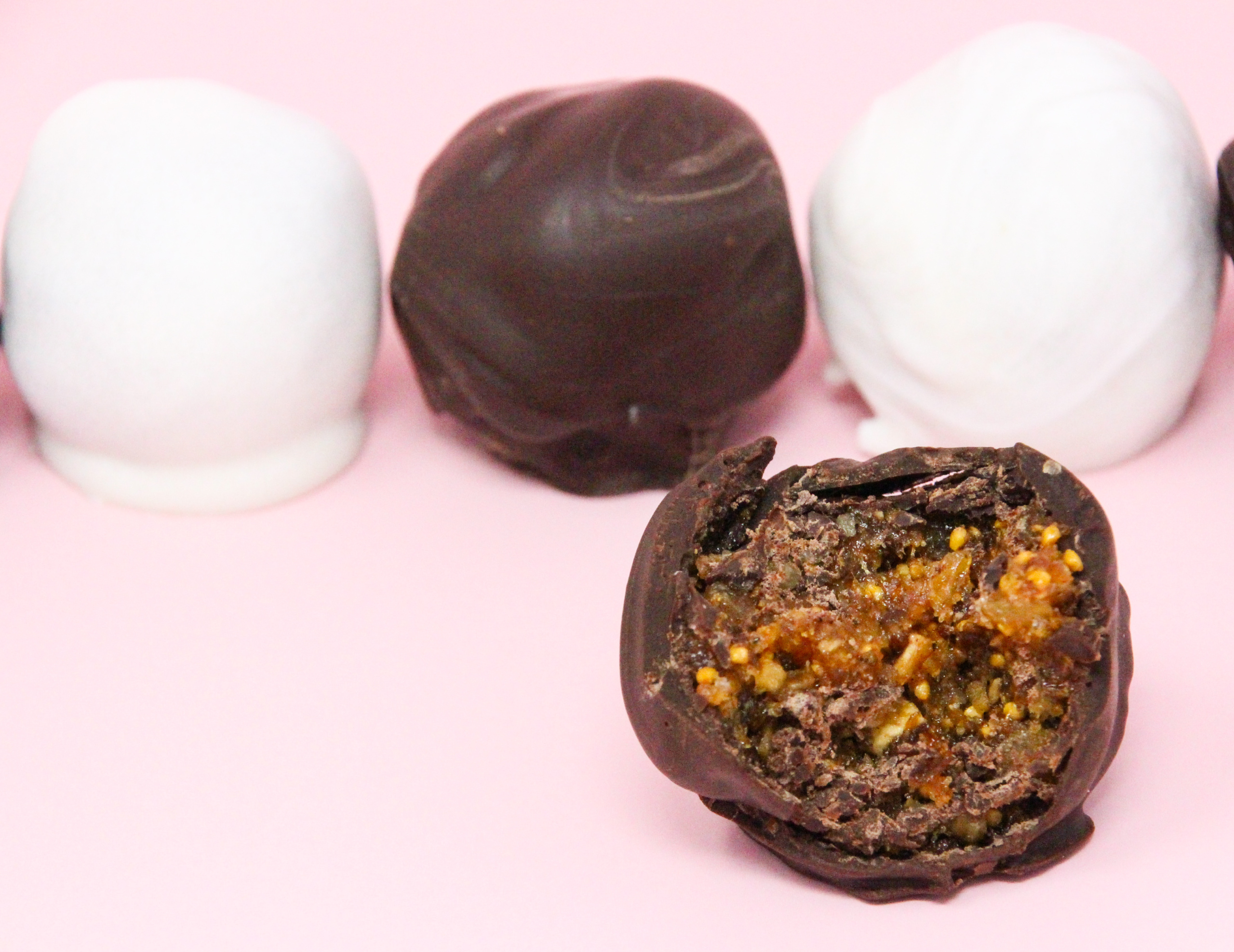 Fig, Ginger, Cardamom Truffles are a tempting combination of figs with spices, all enrobed in dark chocolate, making these scrumptious morsels a perfect bite to end dinner with. Recipe shared with permission granted by Molly MacRae, author of THERE'LL BE SHELL TO PAY.