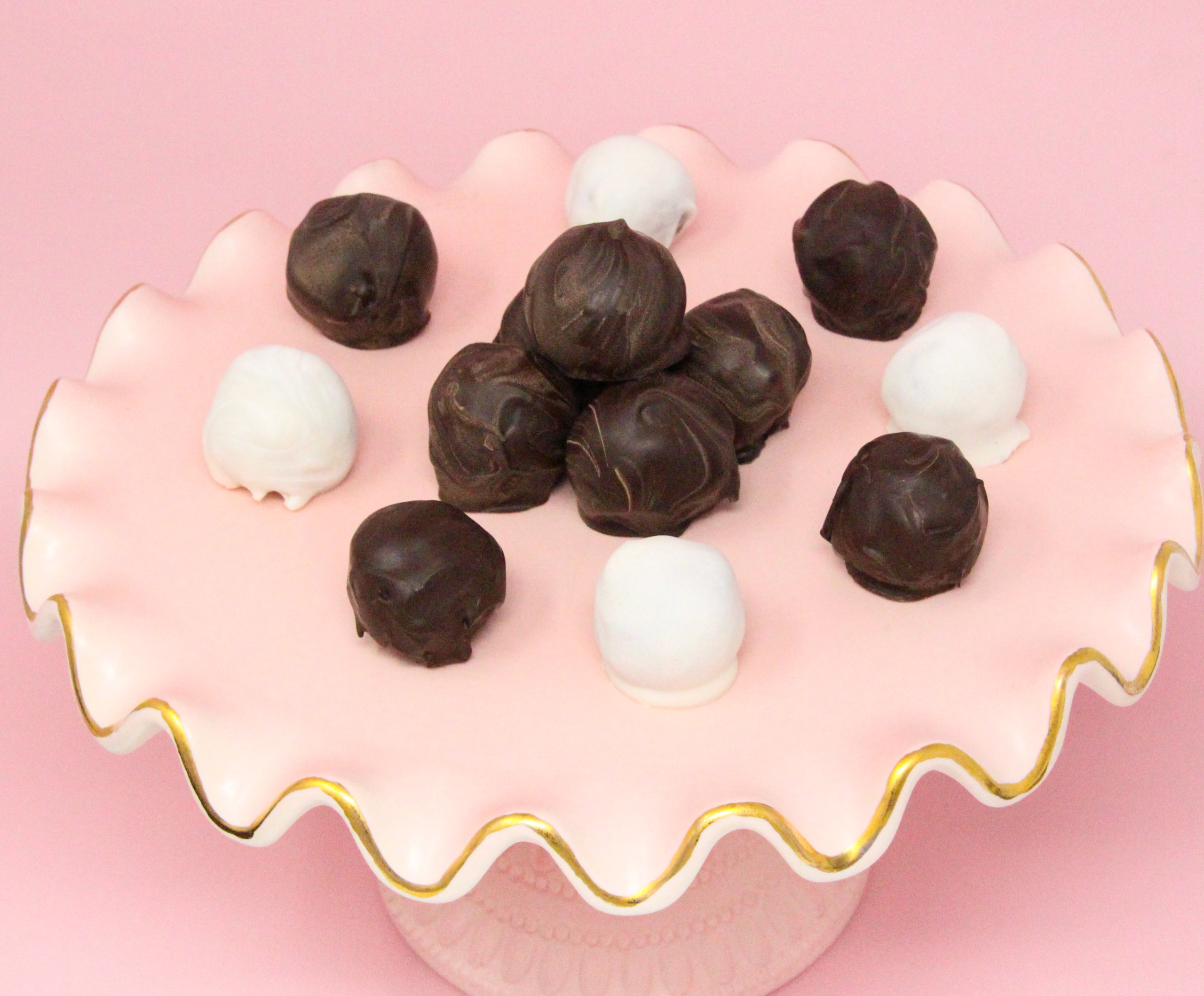 Fig, Ginger, Cardamom Truffles are a tempting combination of figs with spices, all enrobed in dark chocolate, making these scrumptious morsels a perfect bite to end dinner with. Recipe shared with permission granted by Molly MacRae, author of THERE'LL BE SHELL TO PAY.