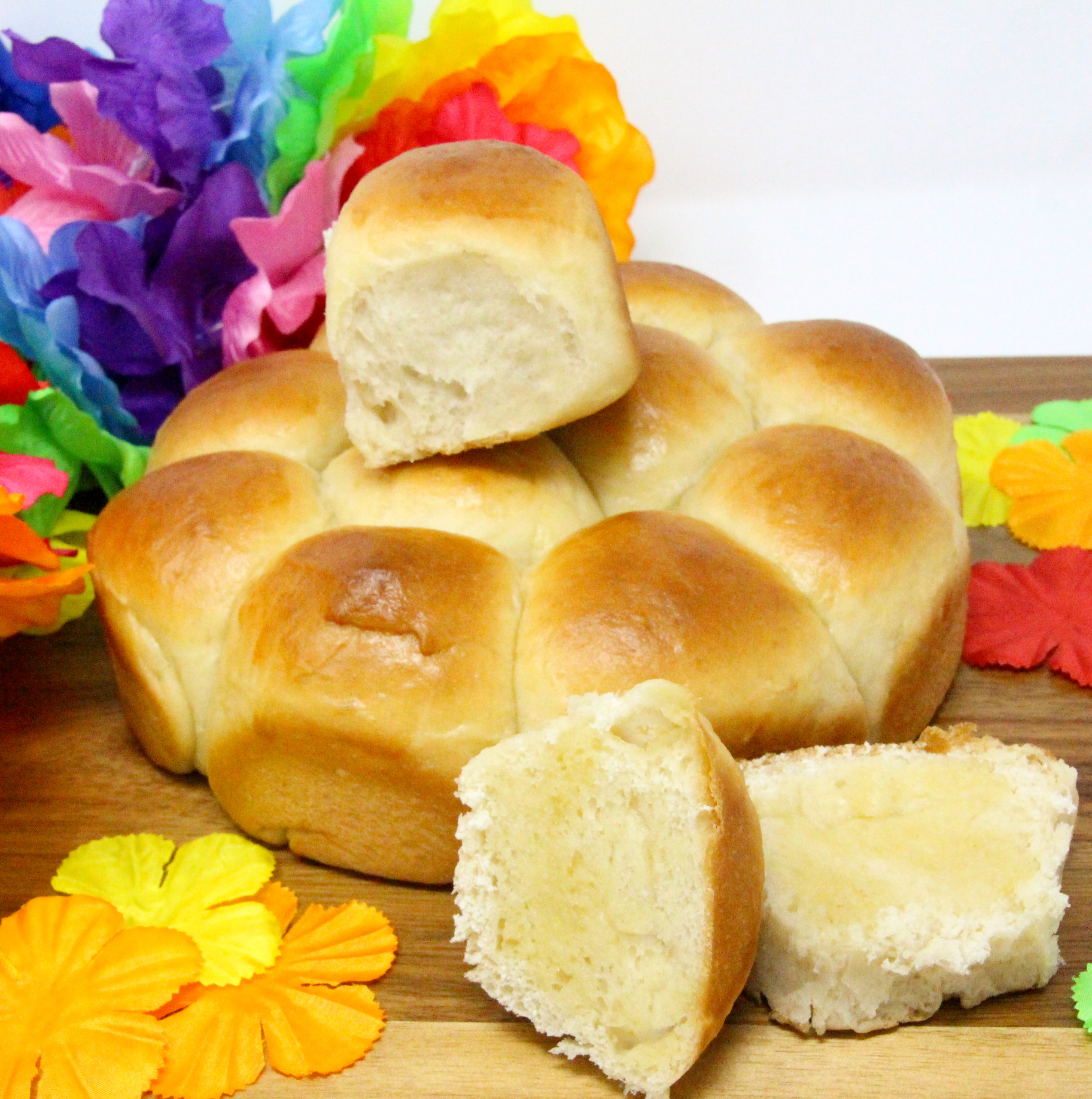Soft and sweet, Hawaiian Rolls have a tropical taste thanks to the use of pineapple juice. These are perfect on their own, slathered with butter, or make an ideal base for BBQ pulled pork sliders, Hawaiian style. Recipe created by Cinnamon & Sugar for Catherine Bruns, author of DEATH OF THE HULA GIRL. 