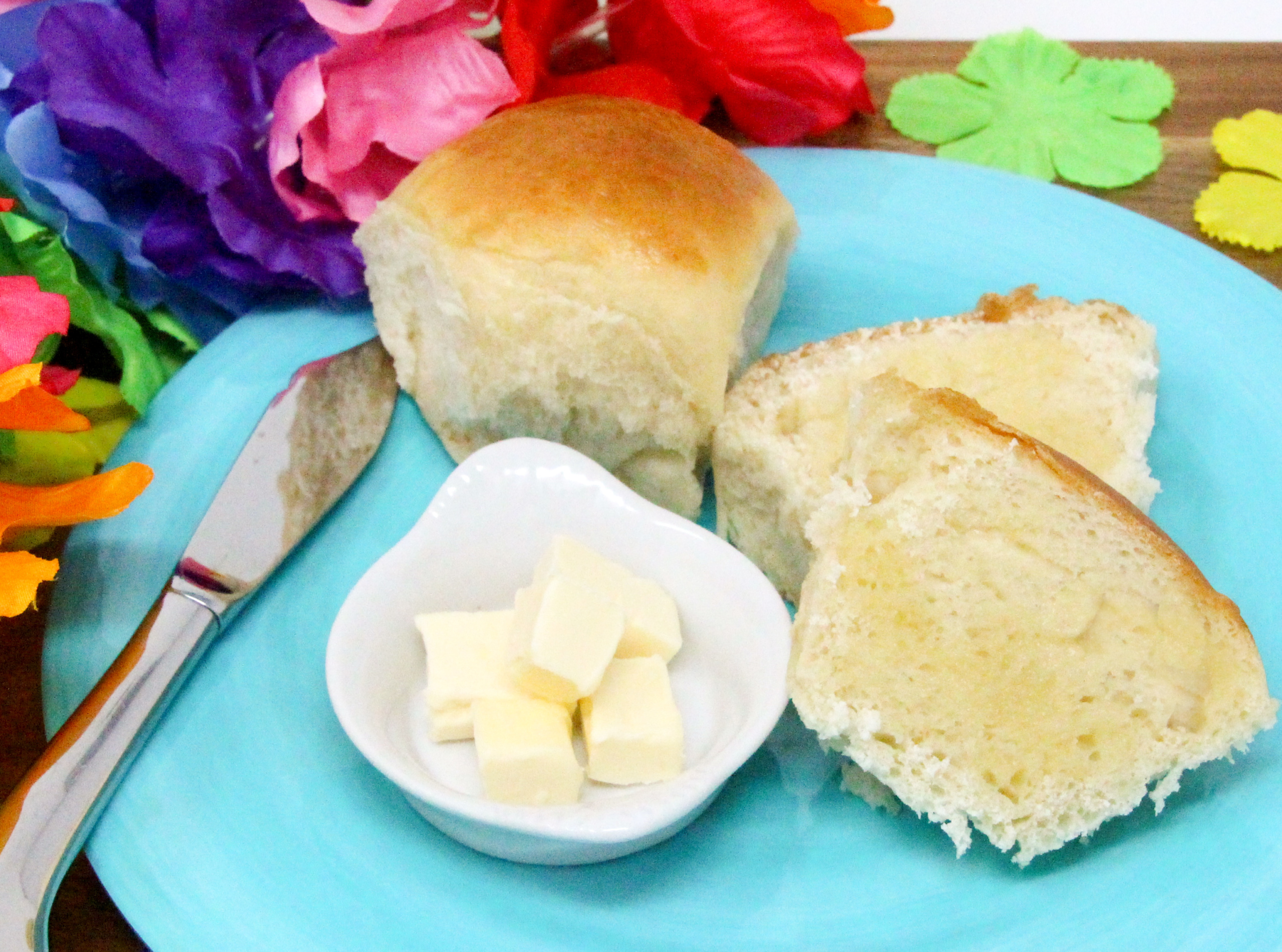 Soft and sweet, Hawaiian Rolls have a tropical taste thanks to the use of pineapple juice. These are perfect on their own, slathered with butter, or make an ideal base for BBQ pulled pork sliders, Hawaiian style. Recipe created by Cinnamon & Sugar for Catherine Bruns, author of DEATH OF THE HULA GIRL. 
