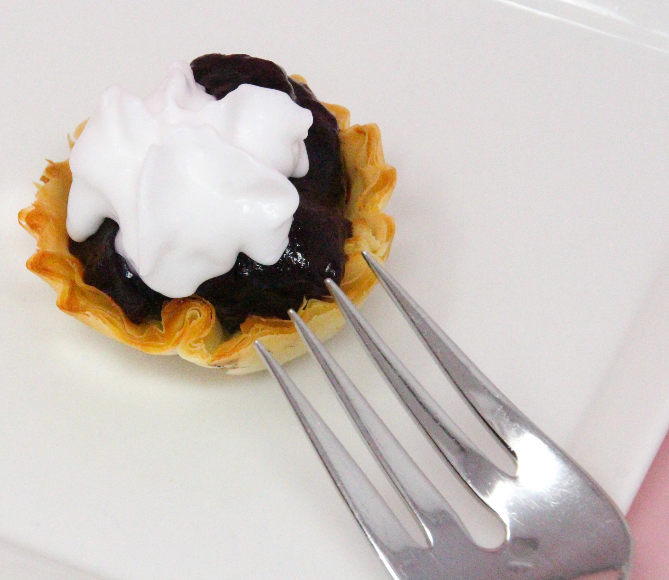 Simple blueberry tarts start with the convenience of frozen mini tart shells, then filled with fresh blueberries lightly sweetened and given added flavor with tart lemon juice. These bite-sized morsels are delicious and easy to make and serve! Recipe shared with permission granted by Daryl Wood Gerber, author of MURDER BY THE MILLIONS.