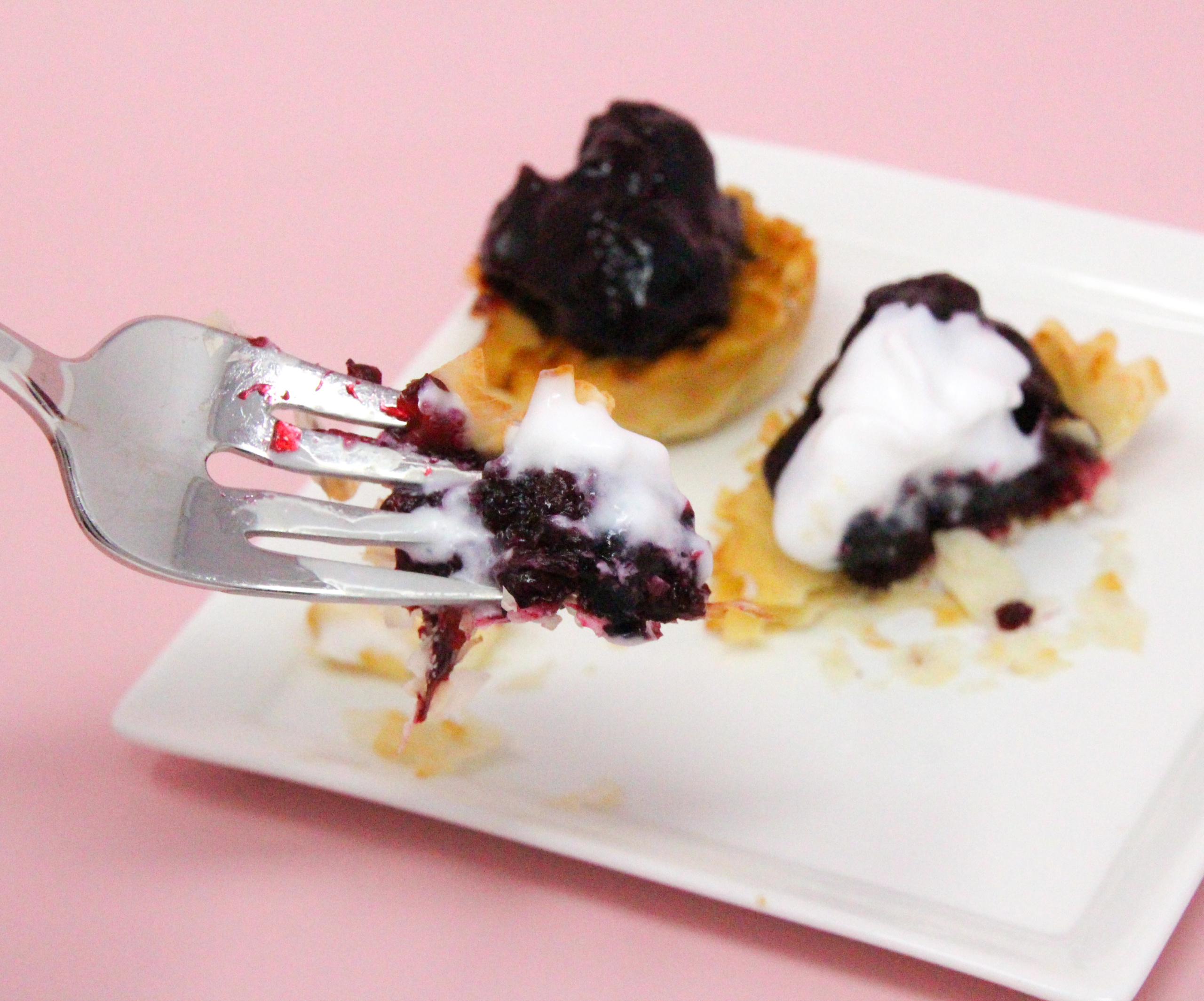 Simple blueberry tarts start with the convenience of frozen mini tart shells, then filled with fresh blueberries lightly sweetened and given added flavor with tart lemon juice. These bite-sized morsels are delicious and easy to make and serve! Recipe shared with permission granted by Daryl Wood Gerber, author of MURDER BY THE MILLIONS.