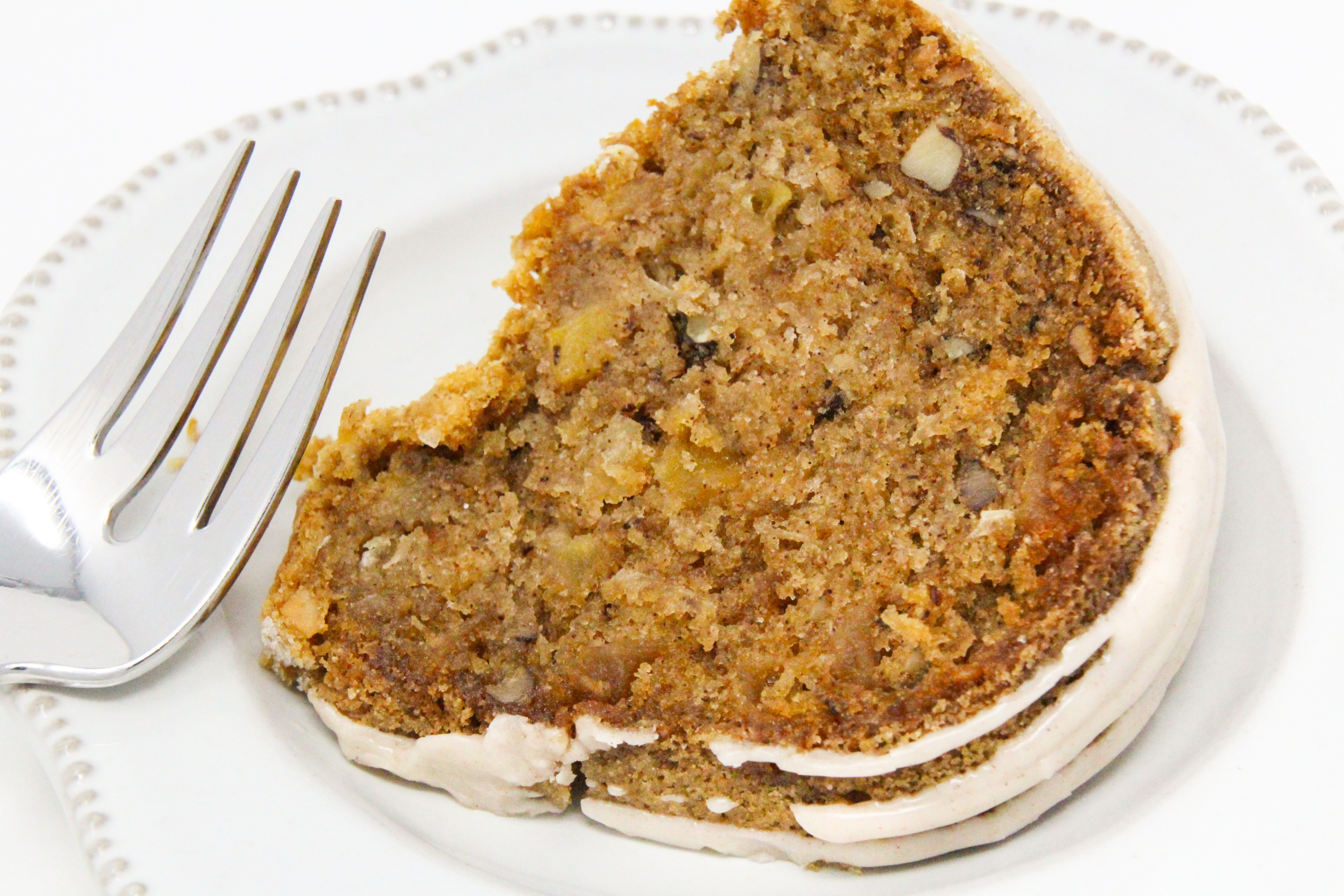 Rob's Apple Cake has generous layers of apples lightly seasoned with cinnamon, while the cake holds a taste of citrus…the perfect combination! With so many apples used and a amount of vegetable oil, the cake is ultra-moist, Recipe shared with permission granted by Valerie Burns, author of ICING ON THE MURDER. 