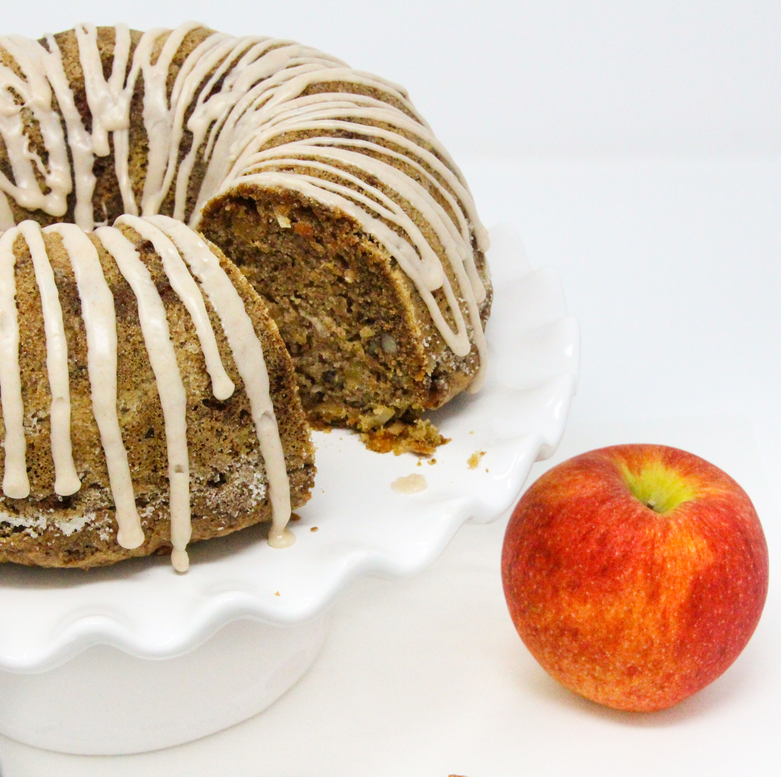 Rob's Apple Cake has generous layers of apples lightly seasoned with cinnamon, while the cake holds a taste of citrus…the perfect combination! With so many apples used and a amount of vegetable oil, the cake is ultra-moist, Recipe shared with permission granted by Valerie Burns, author of ICING ON THE MURDER. 