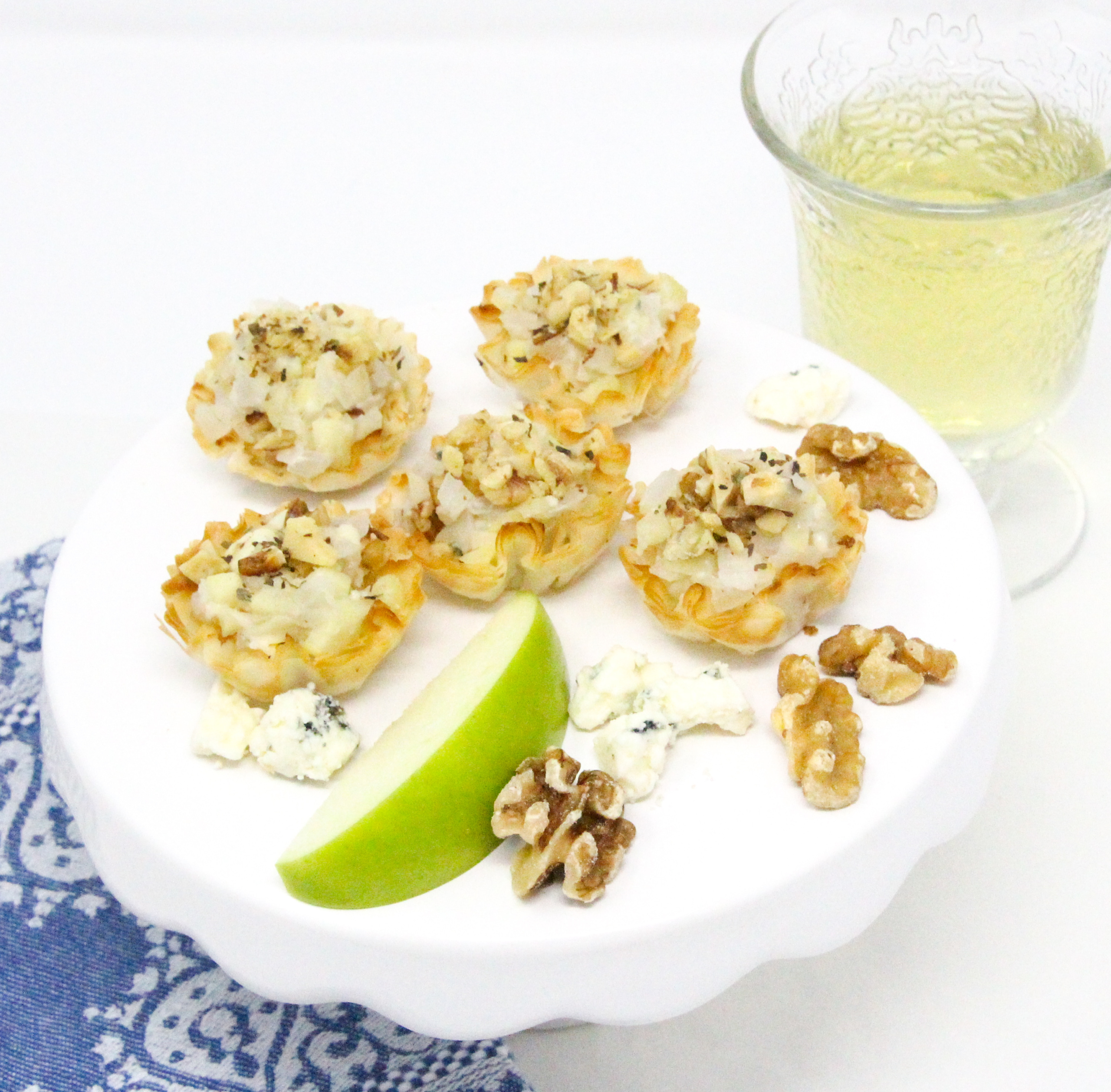 Grant’s Bleu Cheese Tarts--mini bite-sized appetizers-- are filled with a sweet and savory mixture of apple, bleu cheese, and onion. These easy to make nibbles go perfectly with a glass of white wine and will enhance any appetizer platter. Recipe shared with permission granted by Linda Reilly, author of EDAM AND WEEP. 