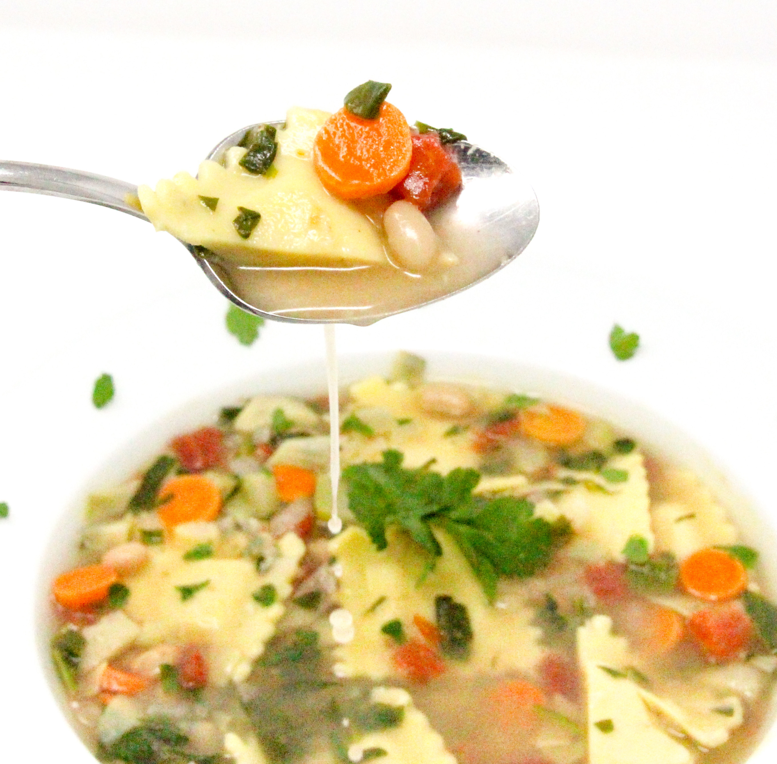 Ravioli Vegetable Soup is a bowl of warm comfort, chockful of veggies and deliciousness! You can even use any kind of cheesy-filled pasta you prefer. Recipe created by Cinnamon & Sugar for Essentials of Death by Kim Davis.