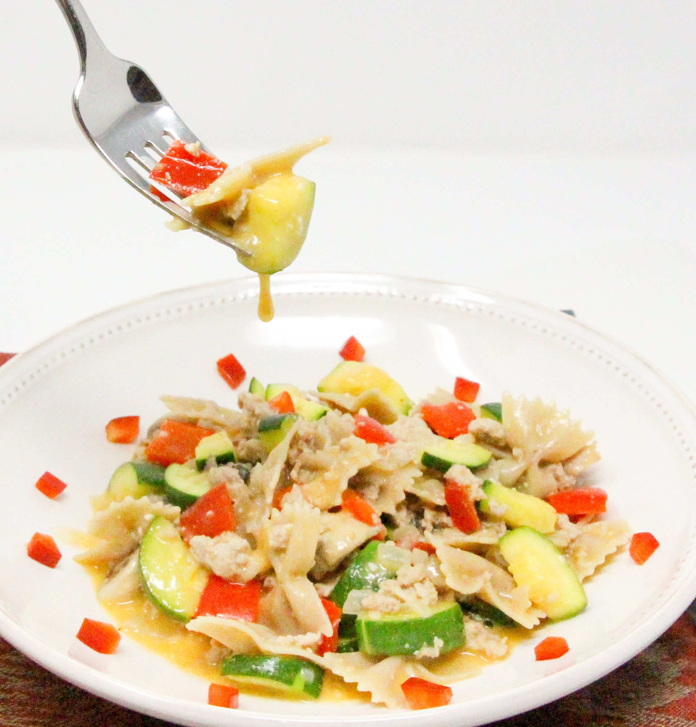 Cheesy Turkey & Veg Pasta is a delicious and filling dish featuring lean protein and plenty of vegetables, all in a cheesy sauce! Recipe shared with permission granted by Victoria Hamilton, author of THANKS FOR MUFFINS. 