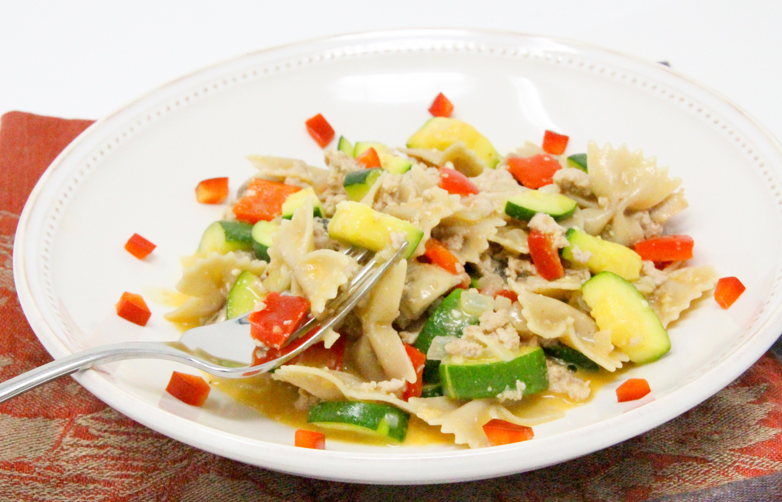 Cheesy Turkey & Veg Pasta is a delicious and filling dish featuring lean protein and plenty of vegetables, all in a cheesy sauce! Recipe shared with permission granted by Victoria Hamilton, author of THANKS FOR MUFFINS. 