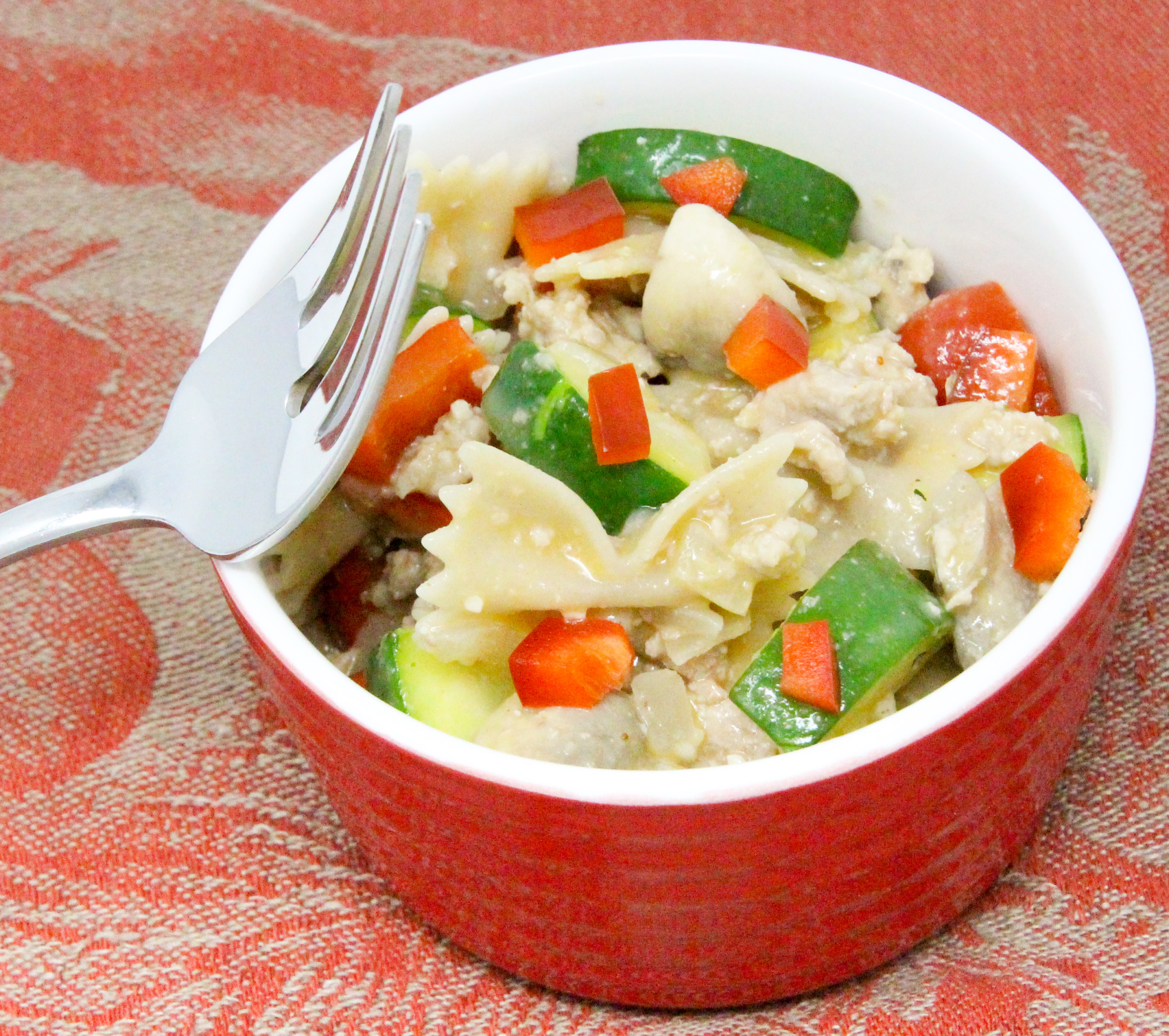 Cheesy Turkey & Veg Pasta is a delicious and filling dish featuring lean protein and plenty of vegetables, all in a cheesy sauce! Recipe shared with permission granted by Victoria Hamilton, author of THANKS FOR MUFFINS. 